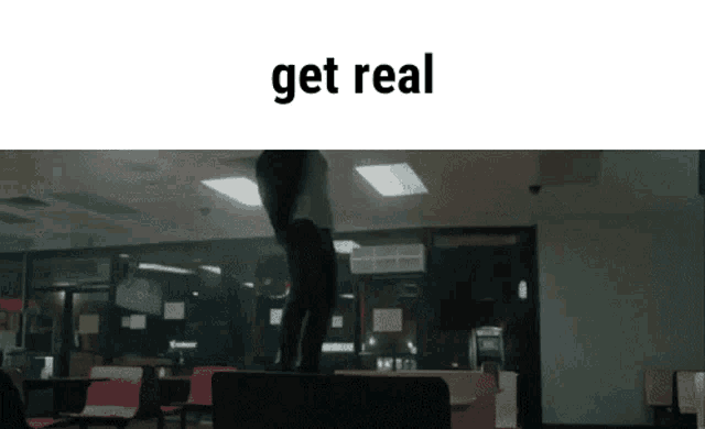 a man is standing on a bench in a room with the words get real written on the bottom