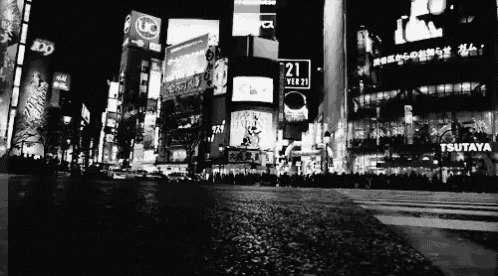 a black and white photo of a city with a sign that says 21 on it