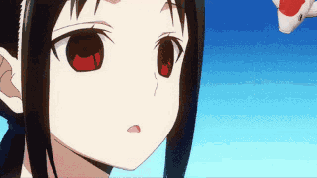 a close up of a girl with red eyes and a blue sky in the background