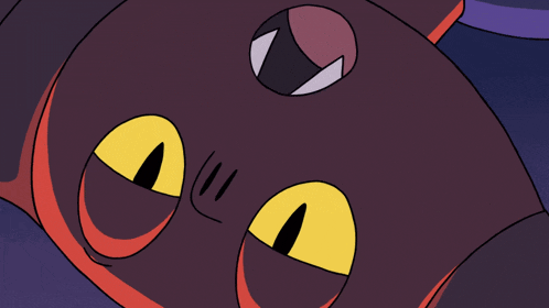 a close up of a cartoon character with yellow eyes and sharp teeth
