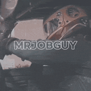 a man wearing a cowboy hat has the word mrjobguy written on his chest