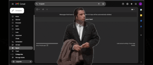 a man in a suit is standing in front of a gmail account