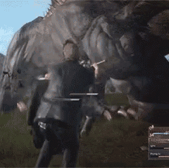 a video game screen shows a man holding a sword in front of a monster ..