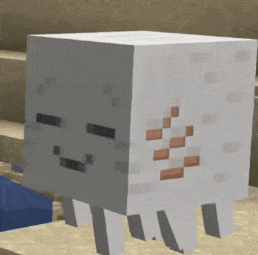 a white block is sitting on a pile of sand