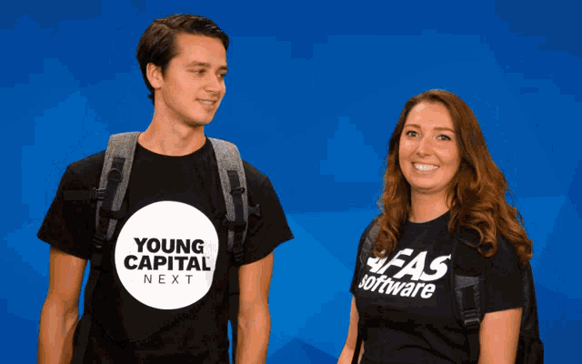 a man and a woman standing next to each other wearing young capital next shirts