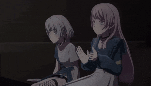 two anime girls are standing next to each other
