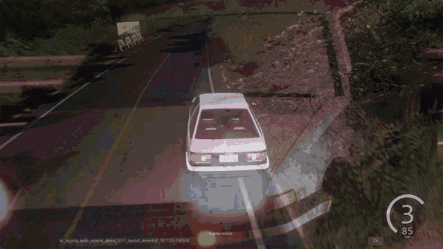 a car is driving down a highway with the number 3 on the bottom right