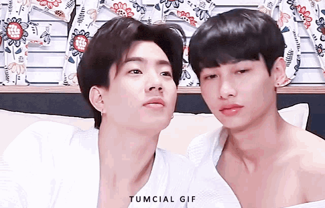 a couple of young men looking at each other with the words tumcial gif on the bottom