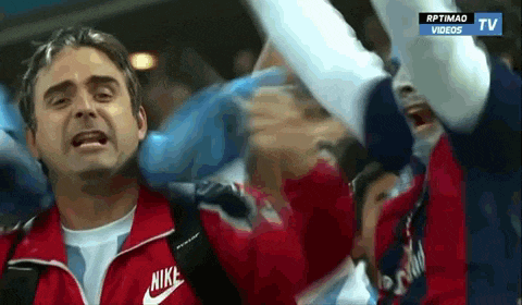 a man wearing a nike jacket stands in front of a tv screen that says rptimao videos