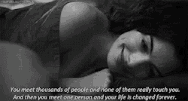 a black and white photo of a woman laying on her stomach with a quote on the bottom