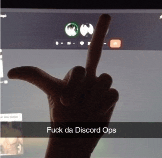 a person is giving the middle finger in front of a computer screen