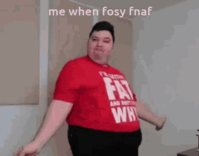 a fat man is wearing a red shirt that says `` fat why '' .