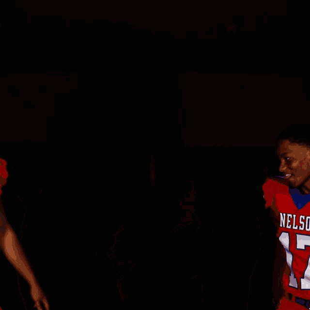 two football players from nelson are posing for a photo