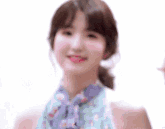 a close up of a woman wearing a floral dress