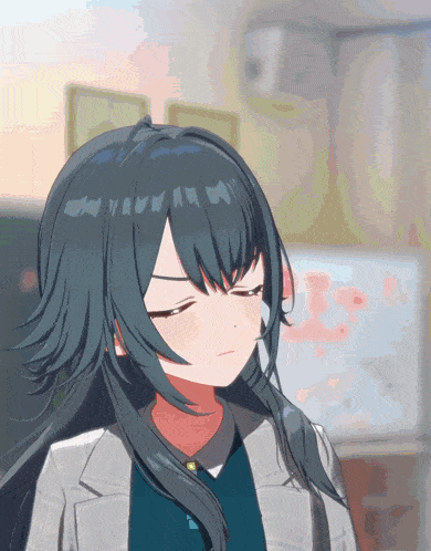 a close up of a girl with long black hair making a face