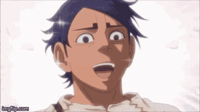 a close up of a man 's face with a surprised look on his face and his mouth open .