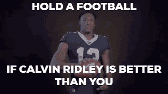 a football player with the number 13 on his jersey holds a football