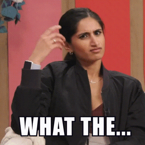a woman in a black jacket is making a face and says what the ...