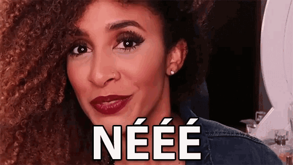 a woman with red lipstick and the word neee in white letters
