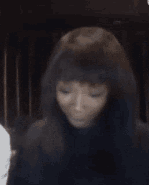 a close up of a woman 's face with a wig on