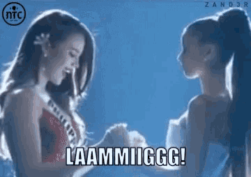 two women are standing next to each other with the caption laammiigg