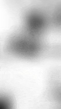 a blurred image of a white background with a shadow of a person on it .