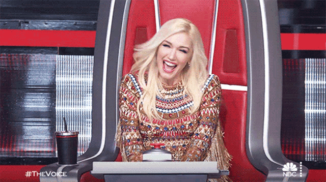 a woman sitting in a chair with a nbc logo on the bottom
