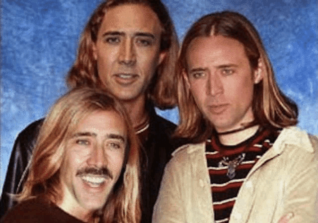 a group of men with long hair and mustaches are posing for a picture