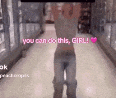a woman is standing in a hallway with the words " you can do this girl " written on the bottom