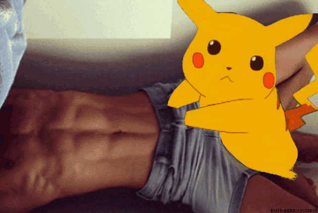 a picture of a man laying on the floor with a pikachu on his stomach