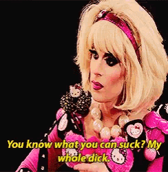 a drag queen in a hello kitty outfit is talking into a microphone