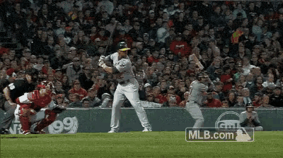 a baseball game is being played with a mlb.com logo in the corner