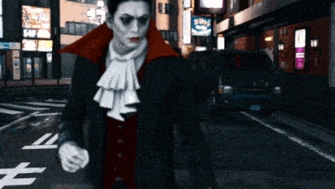 a man in a vampire costume walking down a street