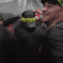 a man wearing a hat that says ' a ' on it