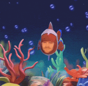 a clown fish with a man 's face on it is swimming in the ocean