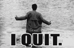 a man is standing in the water with his arms outstretched and giving a thumbs up sign .