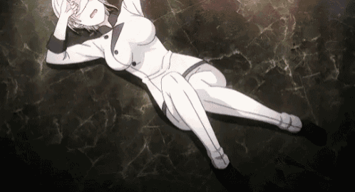 a woman in a white chef 's uniform is laying on the ground .