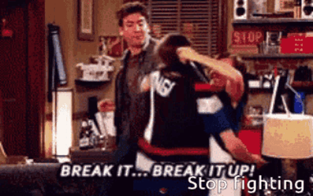a man and a woman are fighting in a living room with the words break it break it up stop fighting on the bottom
