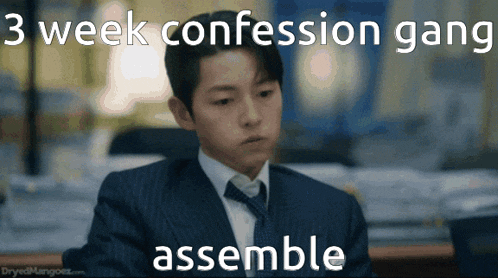 a man in a suit and tie is sitting at a desk with the words 3 week confession gang assemble behind him