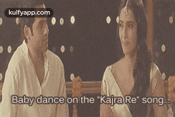 a man and a woman are sitting next to each other and the woman is saying `` baby dance on the kajra re song ... ''