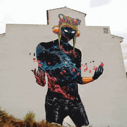 a painting of a man with a hat on the side of a building that says pein on it