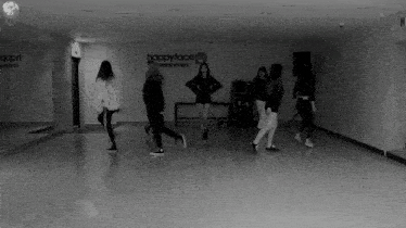a group of girls are dancing in front of a wall that says happyface entertainment