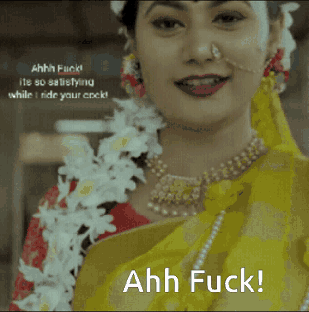a woman wearing a yellow saree and a nose ring says " ahh fuck "