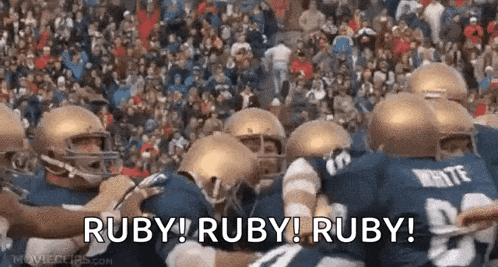 a group of football players are standing in a huddle with the words ruby ruby ruby written in the foreground