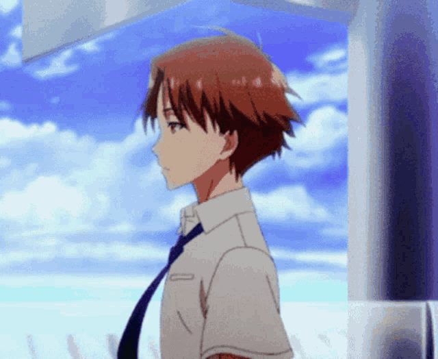 a man with red hair is wearing a white shirt and a blue tie