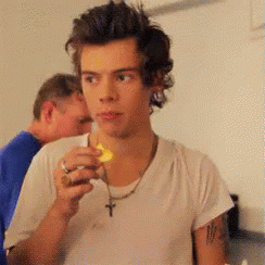 Harry Styles Eating GIF - Harry Styles Eating Orange GIFs