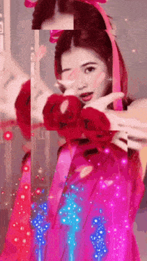a woman in a pink dress with a red bow on her head