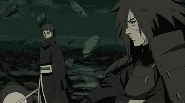 a man with a sword stands next to another man