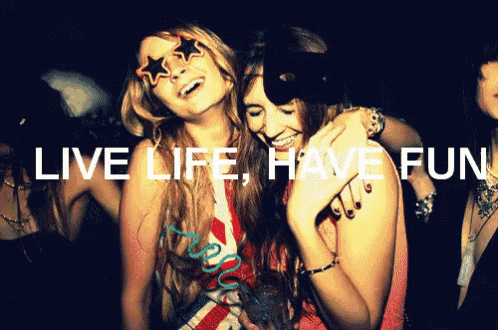 a group of girls laughing with the words " live life have fun " written above them