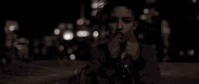 a blurry picture of a woman smoking a cigarette